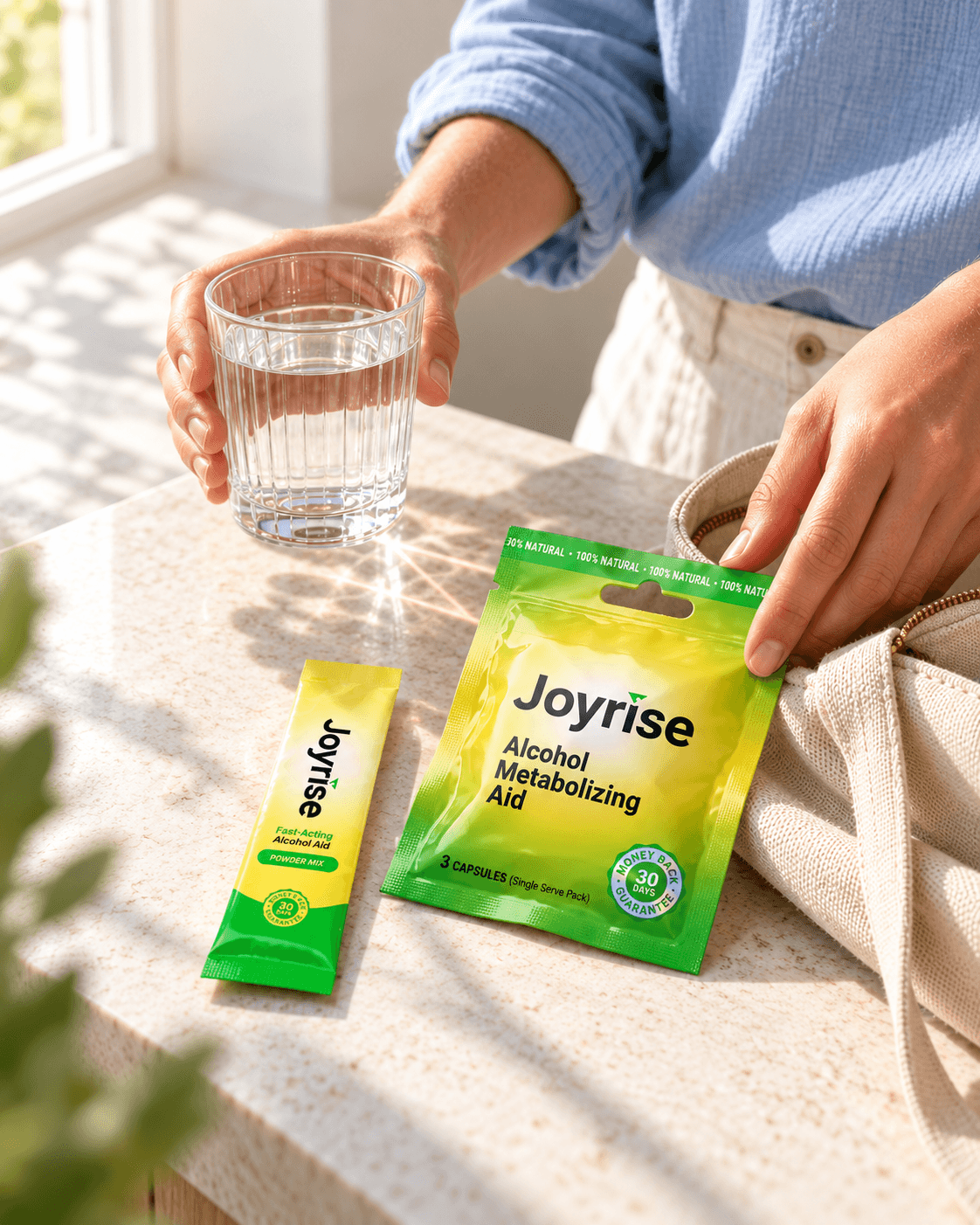Generated everyday-life scene with an adult holding water and placing a sealed Joyrise capsule packet beside a canvas daybag, with a powder stick nearby