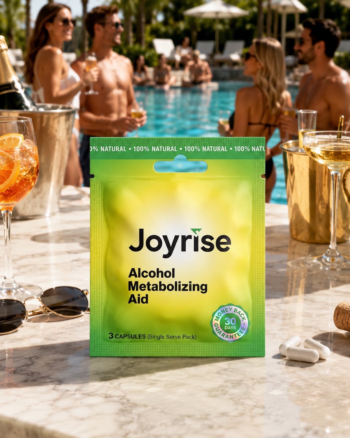 Joyrise capsule packet on a sunny resort counter, with adult friends beside a pool